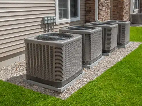Image of a technician repairing an HVAC system